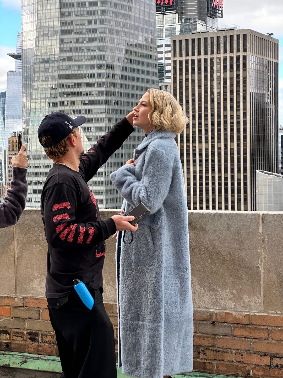 Camera-ready on the rooftop set.